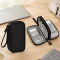 Black double-layer travel tech cable organizer pouch with chargers and cables