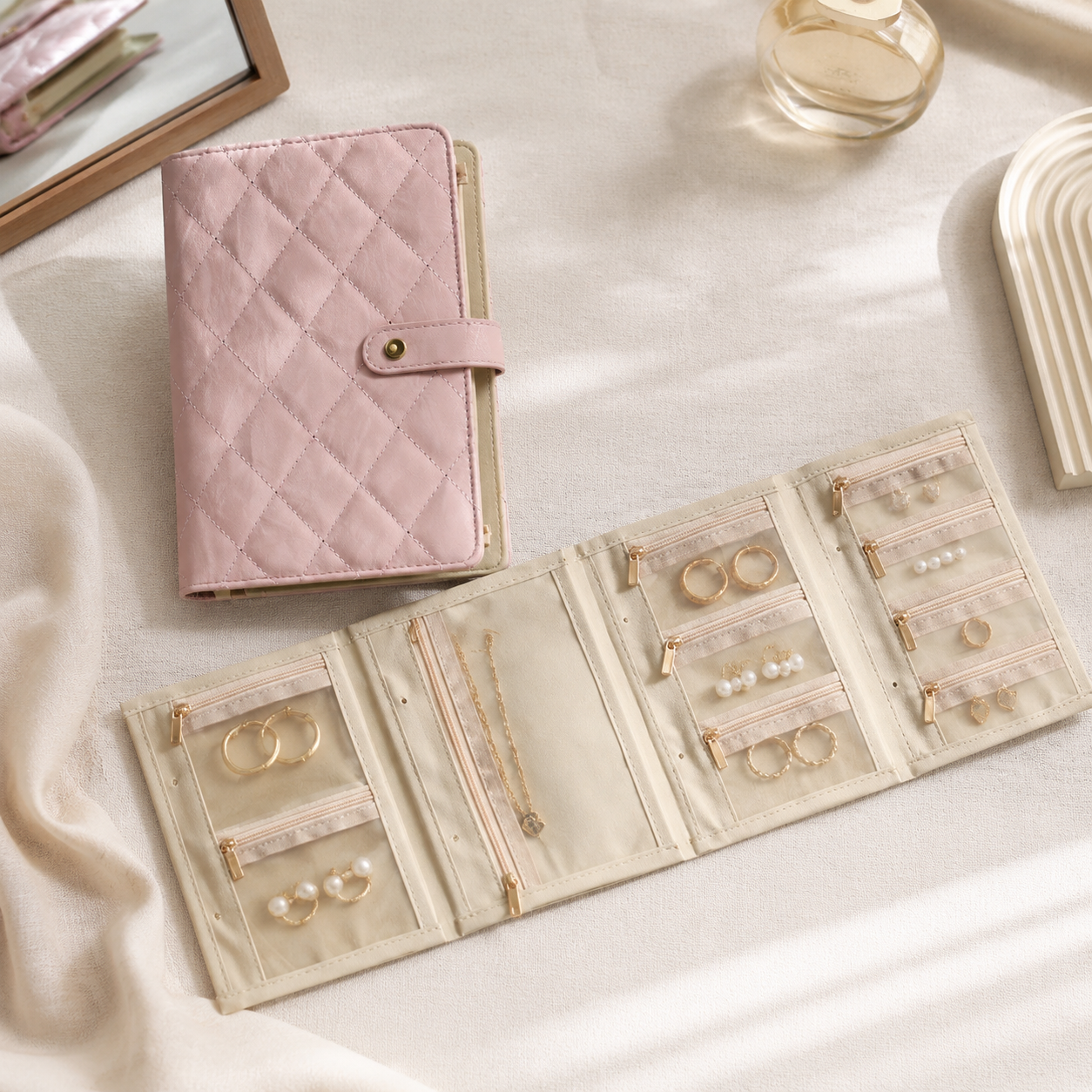 Pink quilted travel jewelry organizer book with earring ring and necklace pages