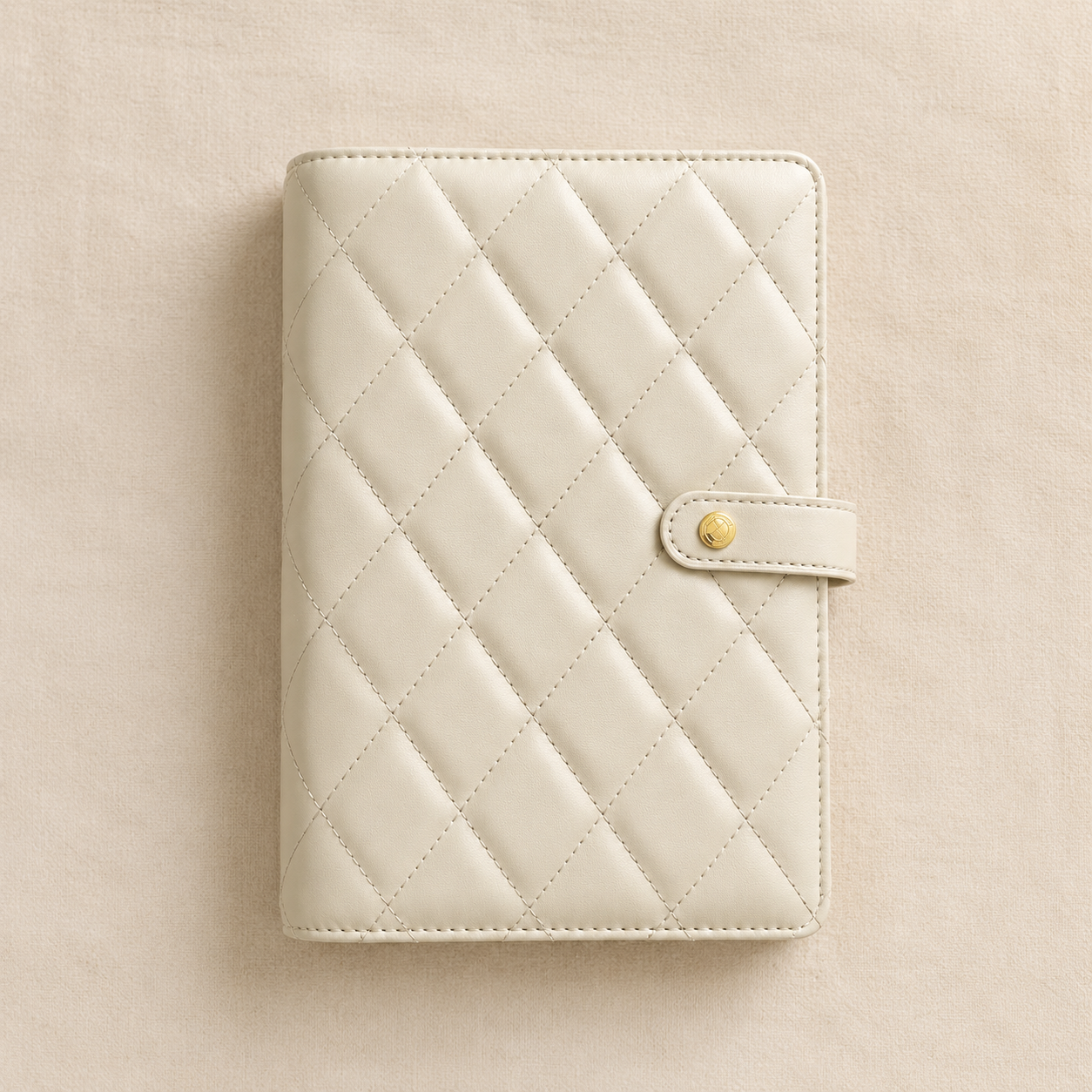 Closed quilted cover detail of the cream travel jewelry organizer book