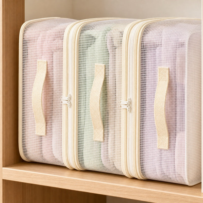 Close-up of clear bedding storage bags with cream handles and zipper trim