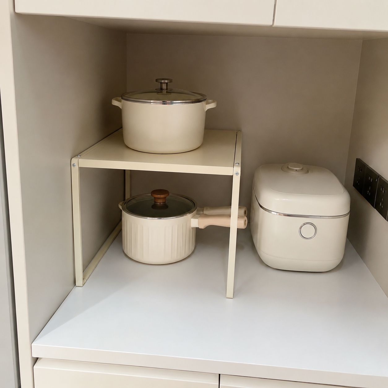 Adjustable shelf rack used on a kitchen counter for cookware and appliances