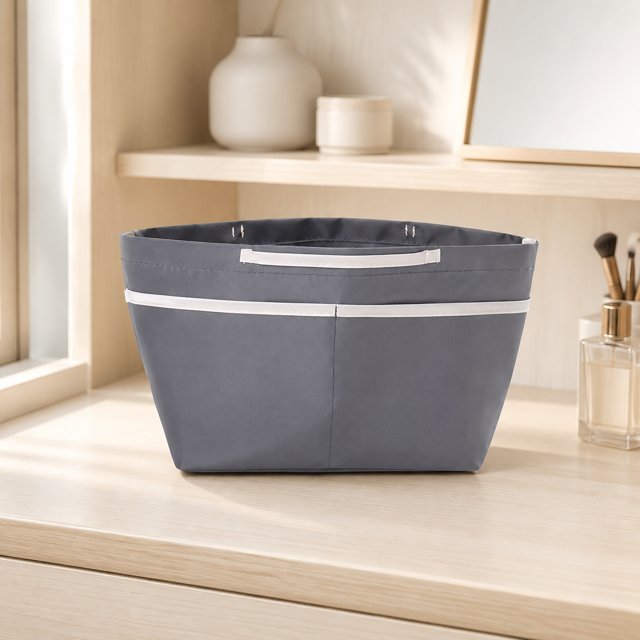 Small sealed gray purse organizer insert with exterior pockets